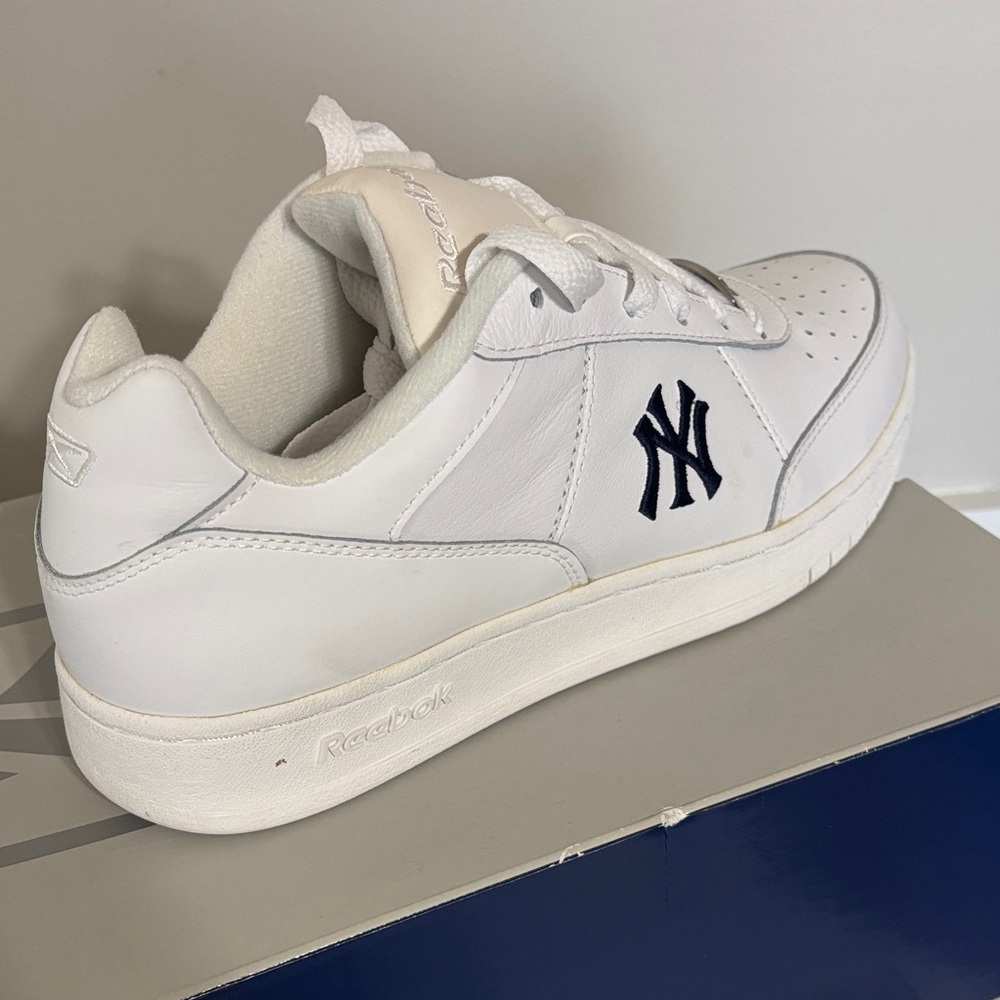 Reebok White Sneakers with Navy Logo